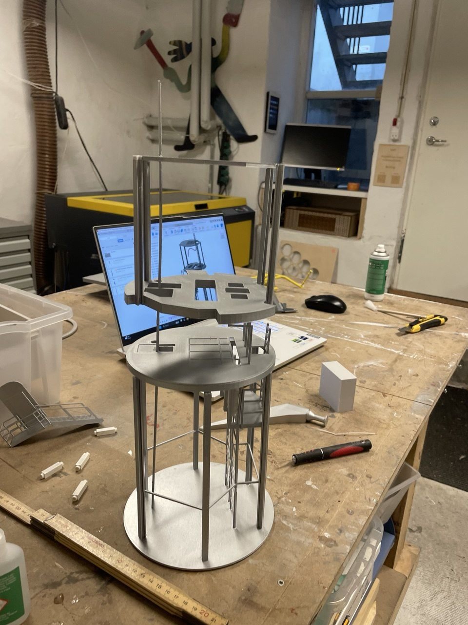 Offshore wind training model being assembled next to its CAD model on a laptop