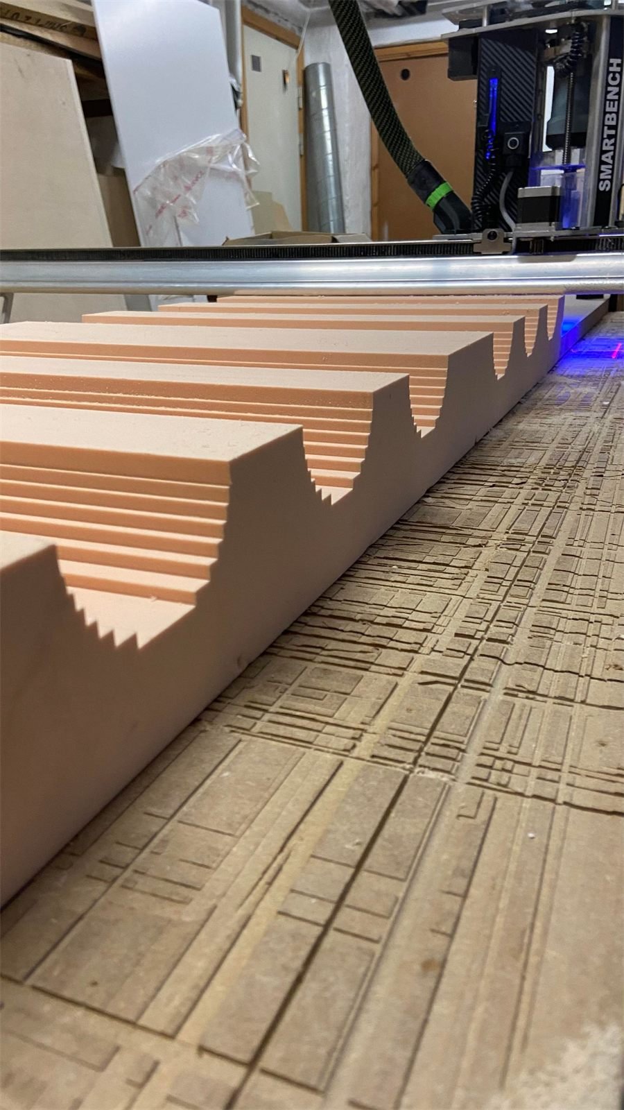Foam parts being CNC machined on the router bed