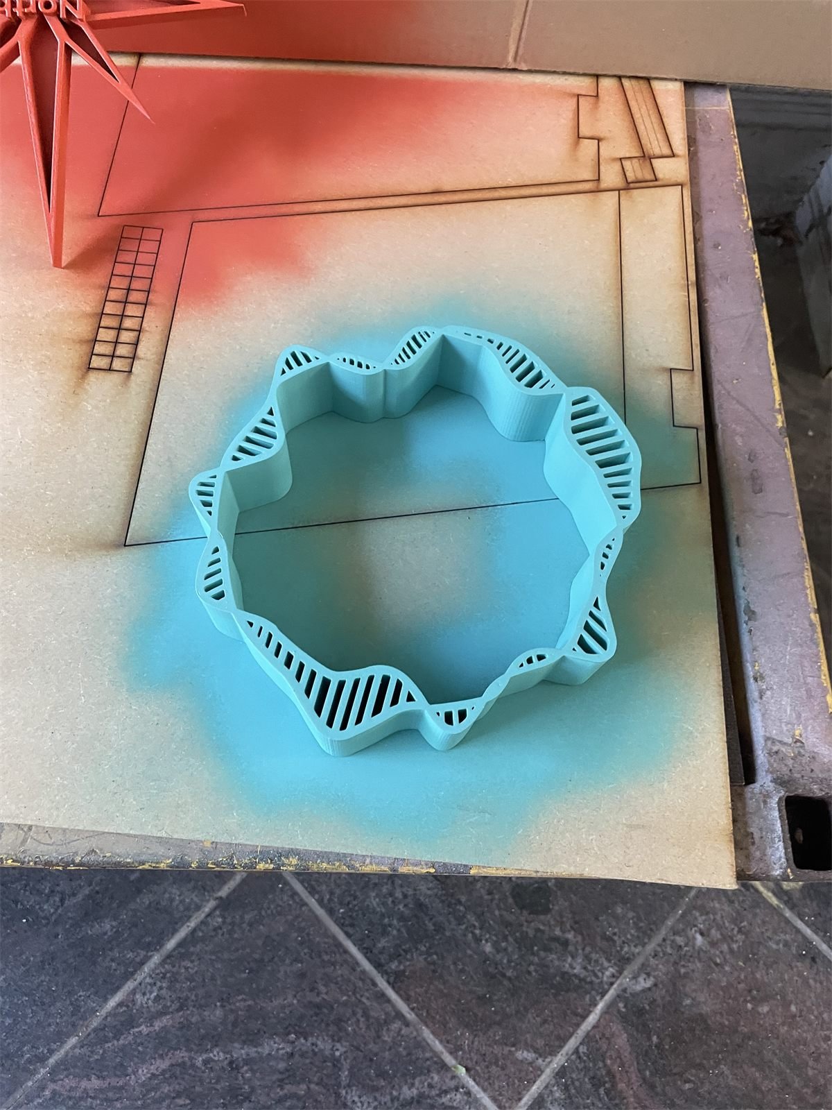 3D printed award freshly spray painted in the workshop