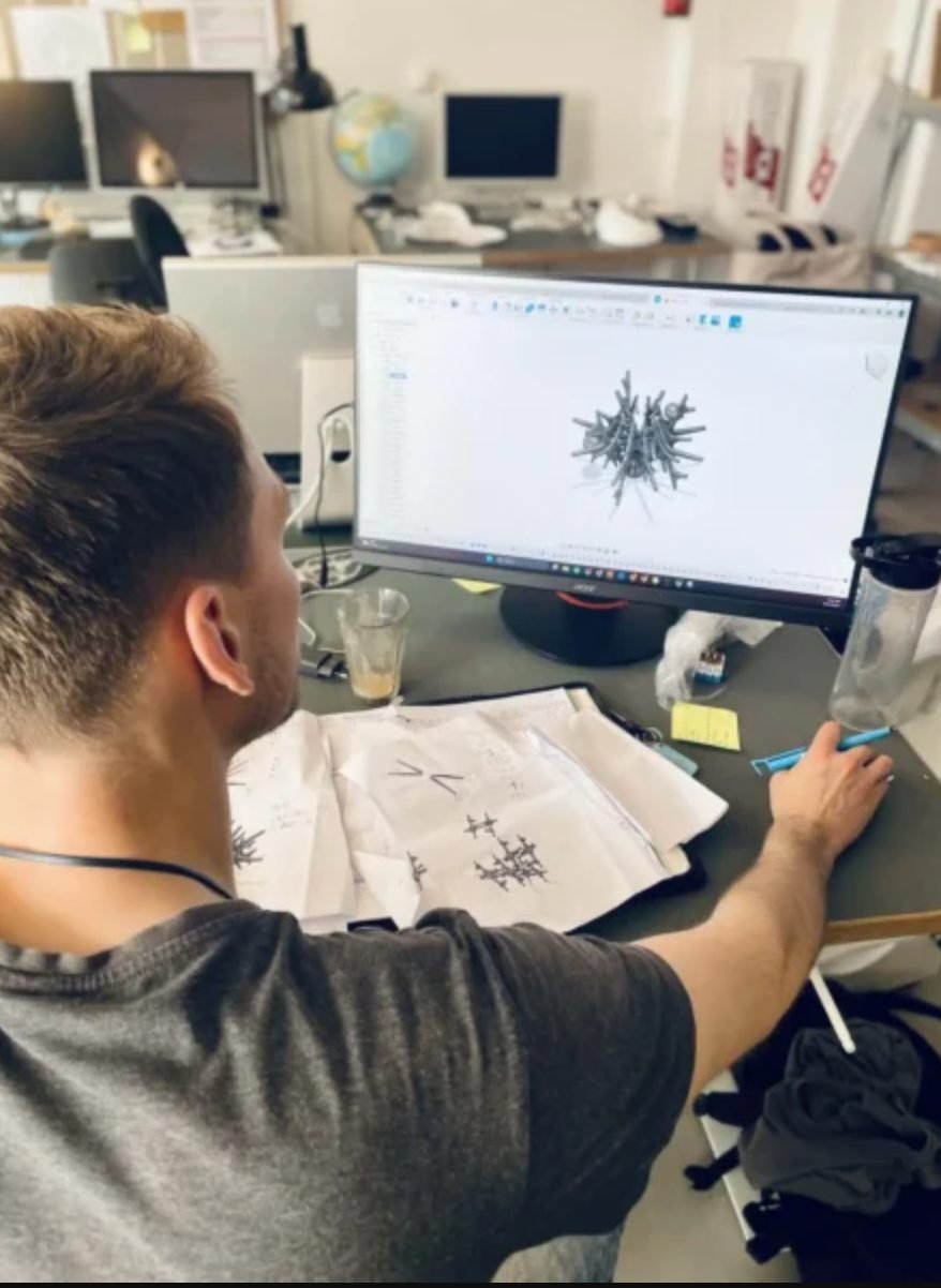 Sketches on the desk and the sculpture modelled in Fusion 360