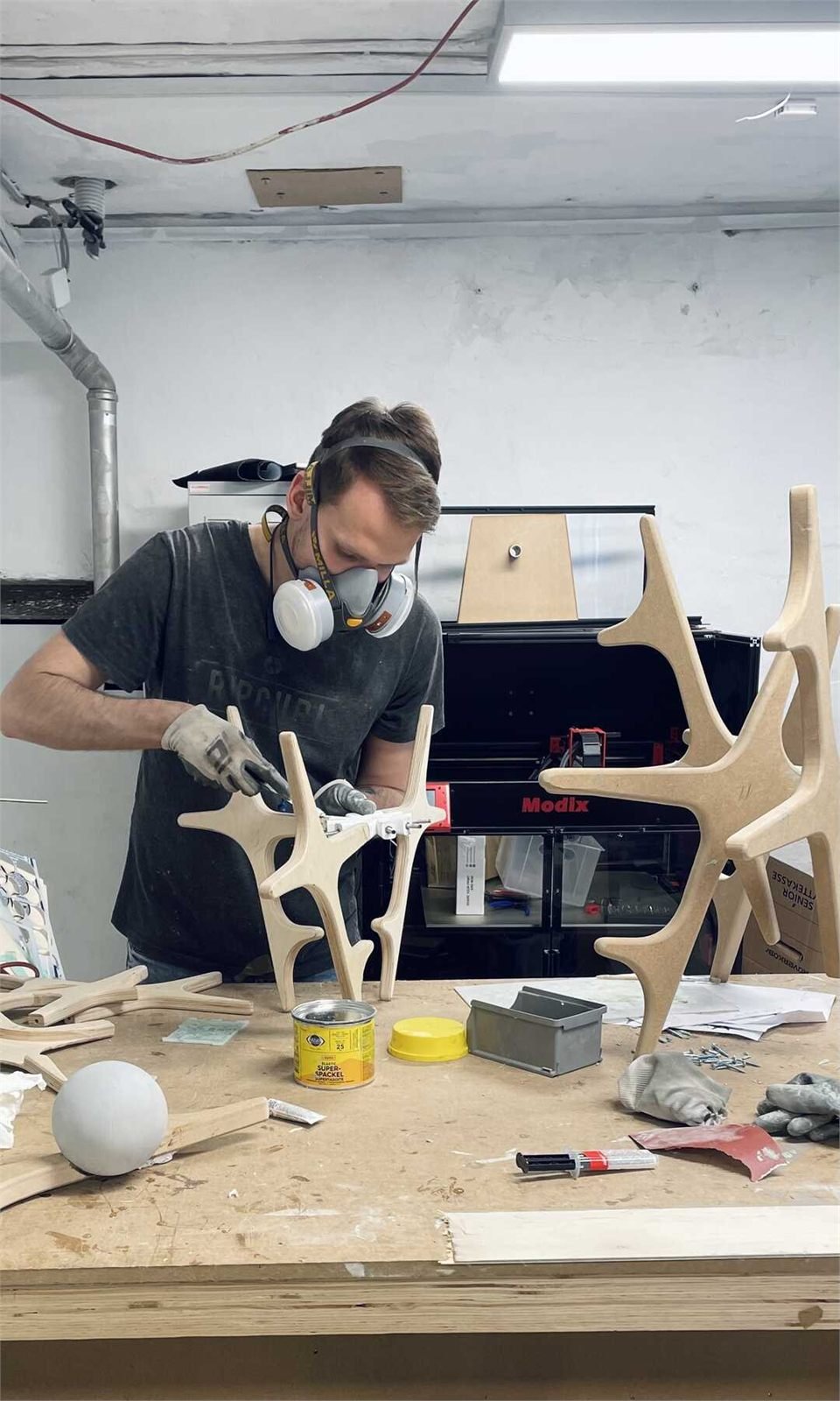 Ignas Valavicius assembling the sculpture's CNC machined parts in the workshop