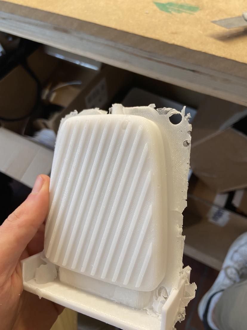 A 3D printed mould with a ribbed part, held in hand