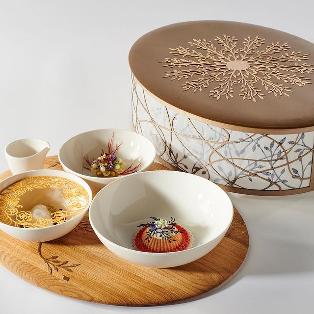 Custom serving pieces in use at a restaurant table
