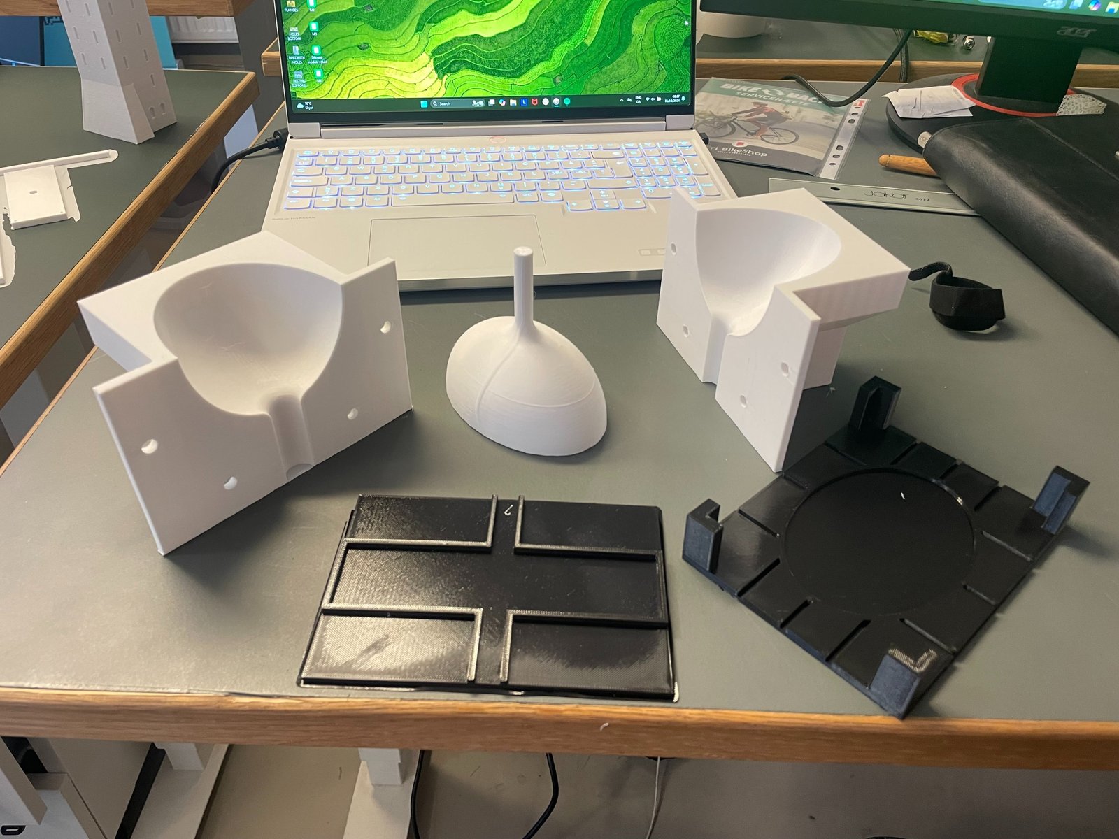 3D printed molds and cast part on the workbench